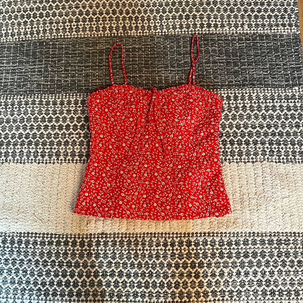 Red shirt with white flowers